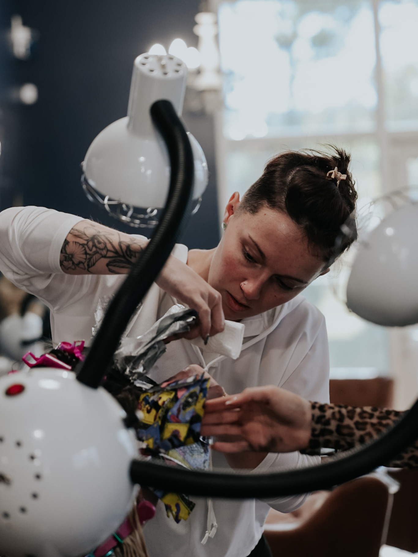 Pearls and Whiskey stylist creating a custom haircut