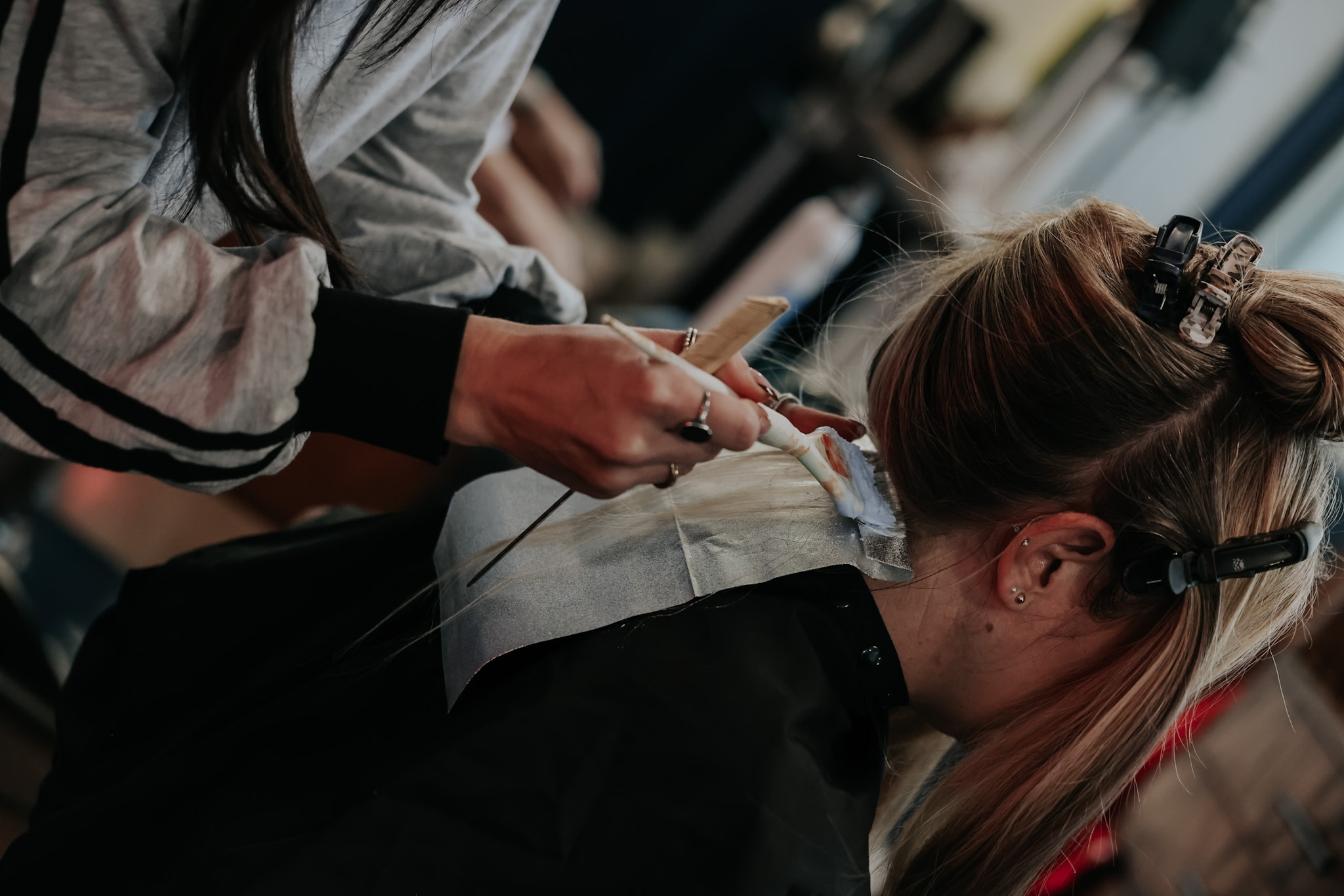 Custom blonding and lived-in color application at Pearls & Whiskey