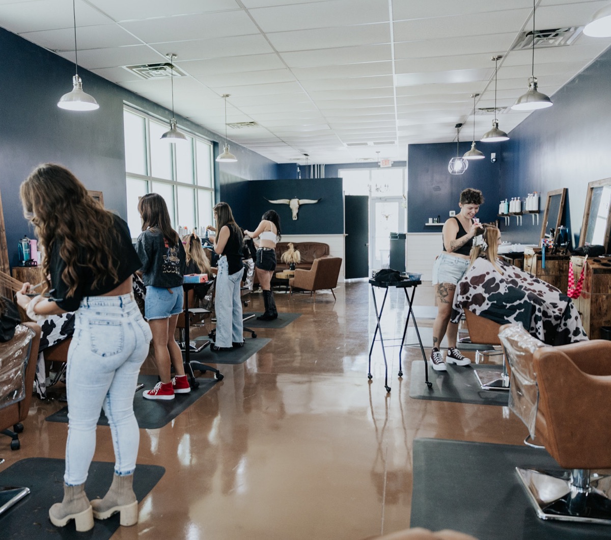 Stylists serving clients inside Pearls & Whiskey in Goose Creek, South Carolina